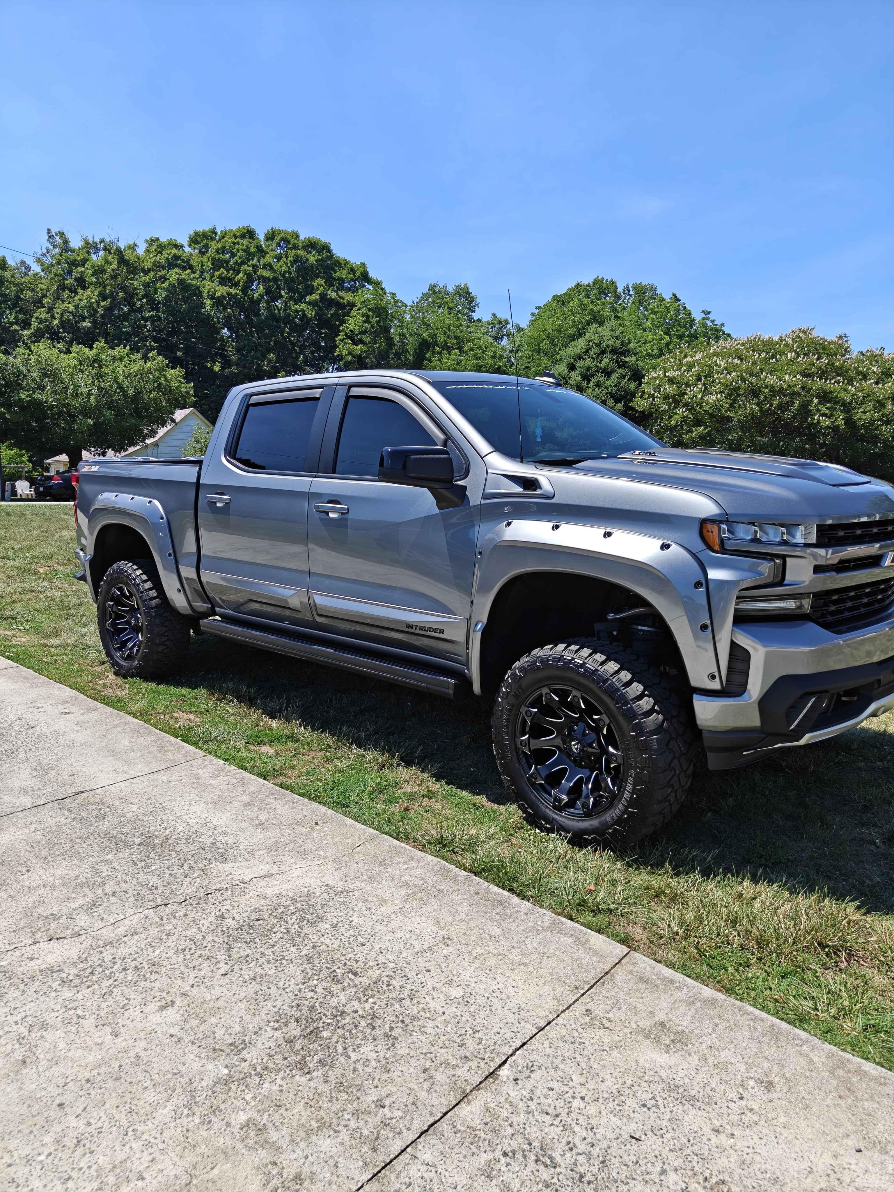 Lifted gray Chevrolet Silverado after a full exterior detail