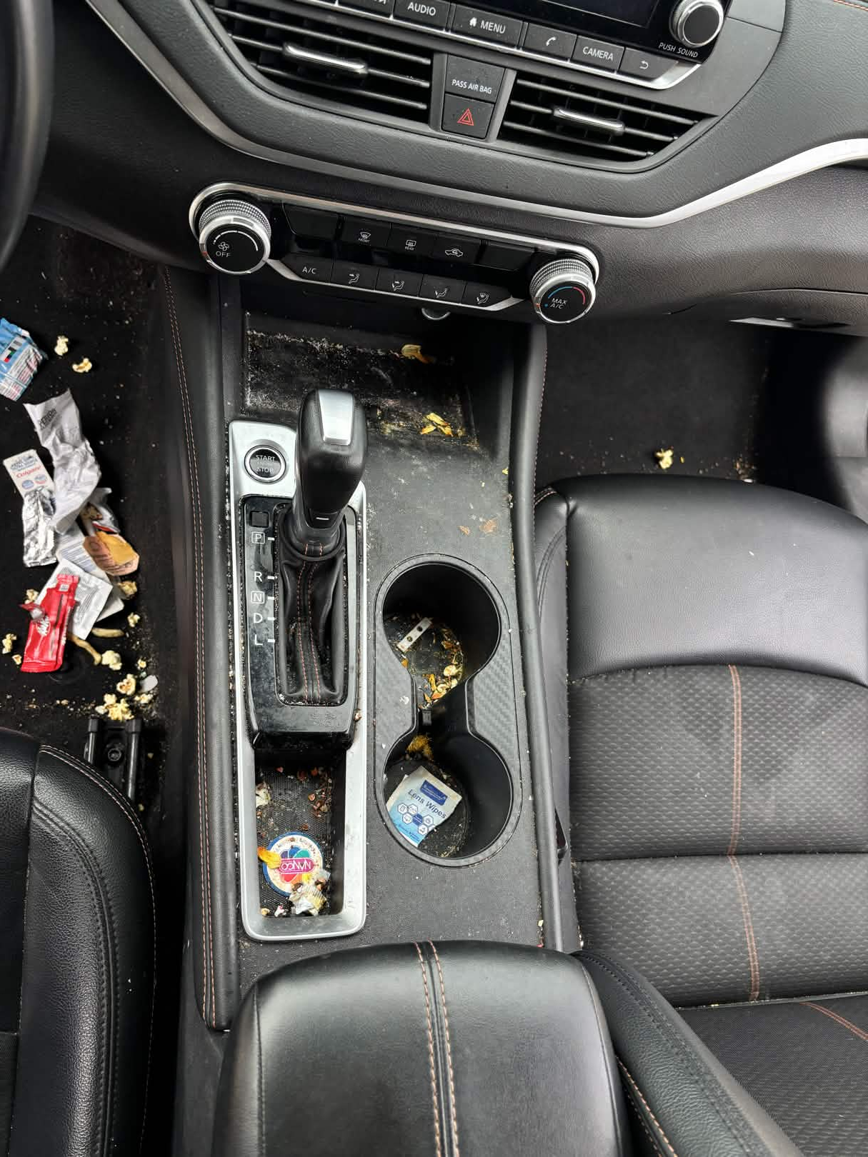 Dirty car interior before a deep clean
